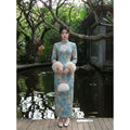 2026 Autumn and Winter Dress Velvet Thickened Long-sleeved Cheongsam Qipao White Jacquard Gentle and Elegant Long Dress